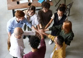 Students hands in a circle